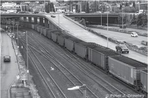 A coal train travels through downtown Tacoma